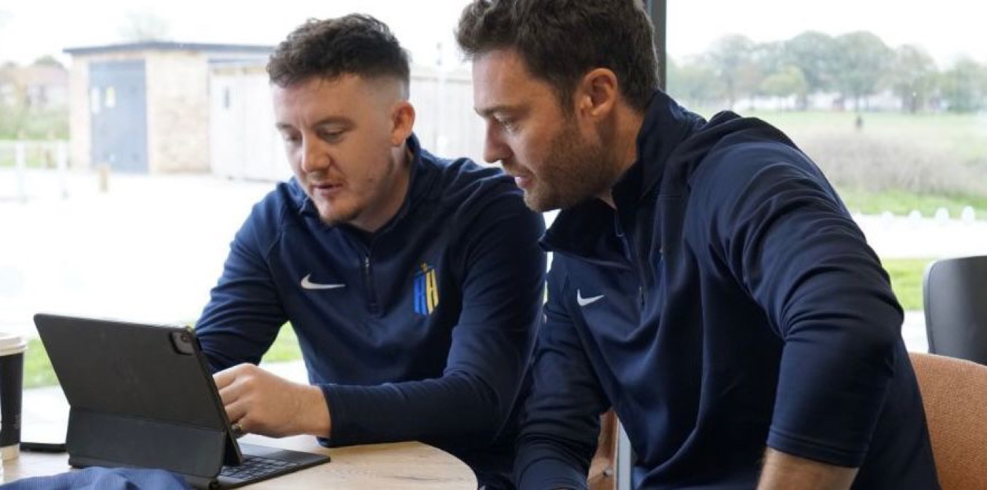 Reviewing match footage together at the training ground